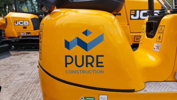 Machinery with Pure Construction Logo